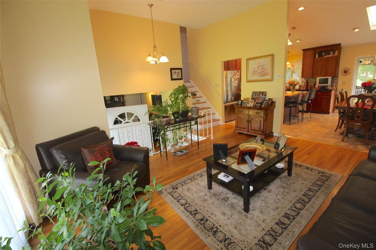 Bright spacious Living Room open to the kitchen.