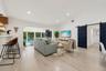 Spacious interior featuring wood-finish flooring, vaulted ceilings, and recessed lighting