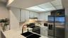 Efficient kitchen with newer appliances.