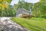 Set back from the road, drive up the paved driveway and come see what awaits you...