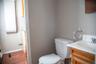 Powder room located conveniently off first floor bedroom and between bedroom and kitchenette.