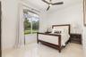 Arched window framing exterior greenery