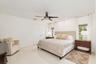 Spacious Primary bedroom featuring, white walls, and a contemporary ceiling fan