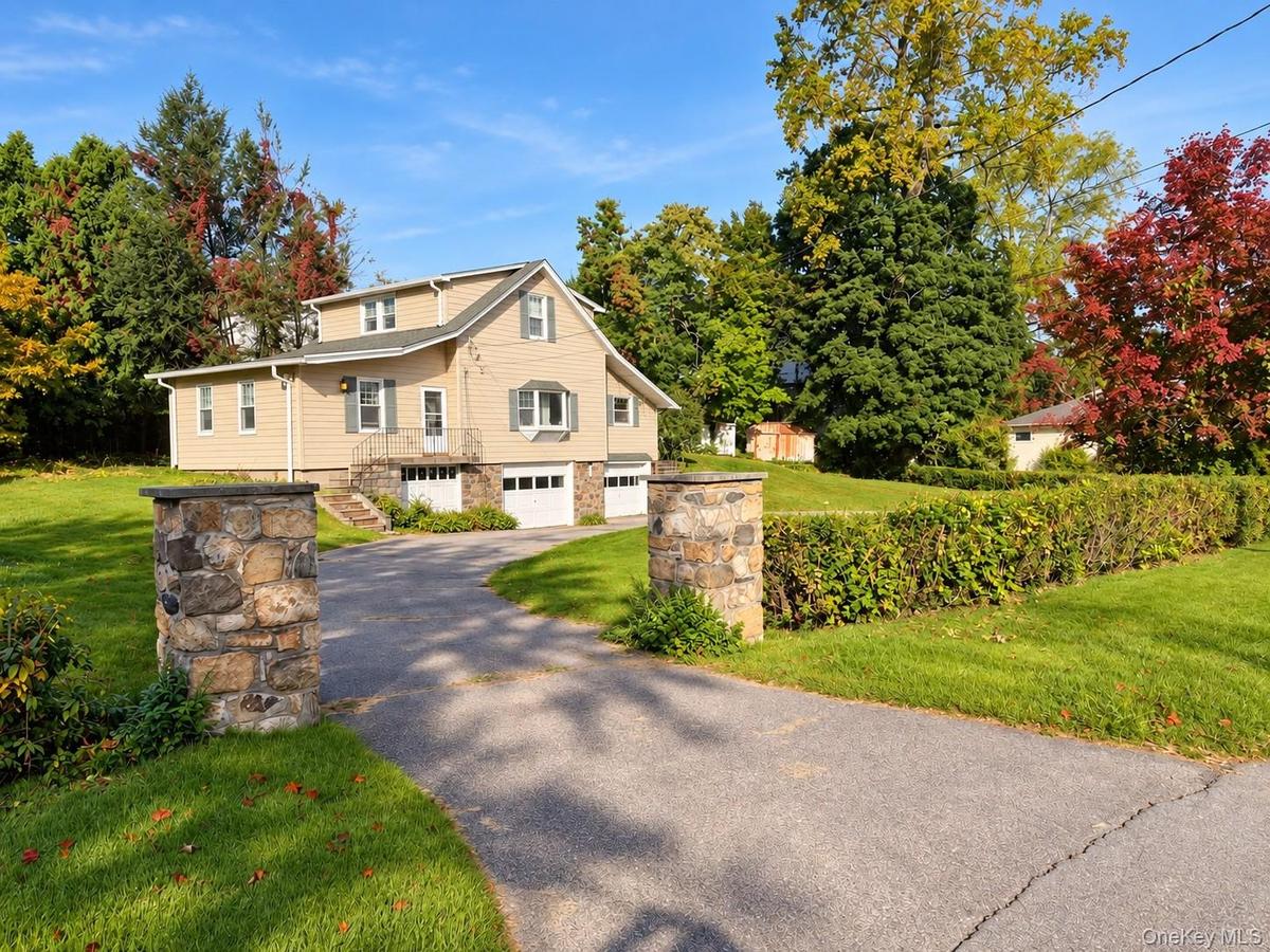 Beautifully Presented Home with Exceptional Curb AppealWelcome to this inviting residence, framed by mature landscaping, lush green lawns, and a disti