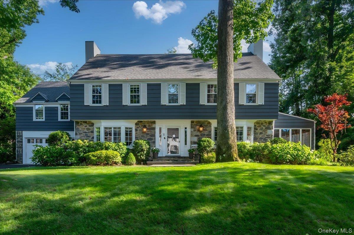 Welcome to 11 South Drive, a stately colonial in the heart of Rouken Glen