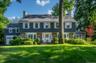 Welcome to 11 South Drive, a stately colonial in the heart of Rouken Glen