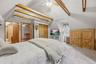 You'll want to spend your Sunday mornings wrapped up in the quiet of the primary bedroom.