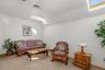 The finished space over the garage is quite comfortable with a tray ceiling, skylights and a full bathroom.  It would be great for an office, teen spa