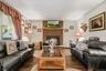 Bringing warmth to the living room is a brick backed pellet stove.