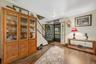 Front entry into the home brings you into the spacious living room.  Walnut LVP lends a farmhouse feel.