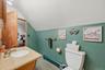2nd floor full bathroom has entrances from the hallway and Primary bedroom.