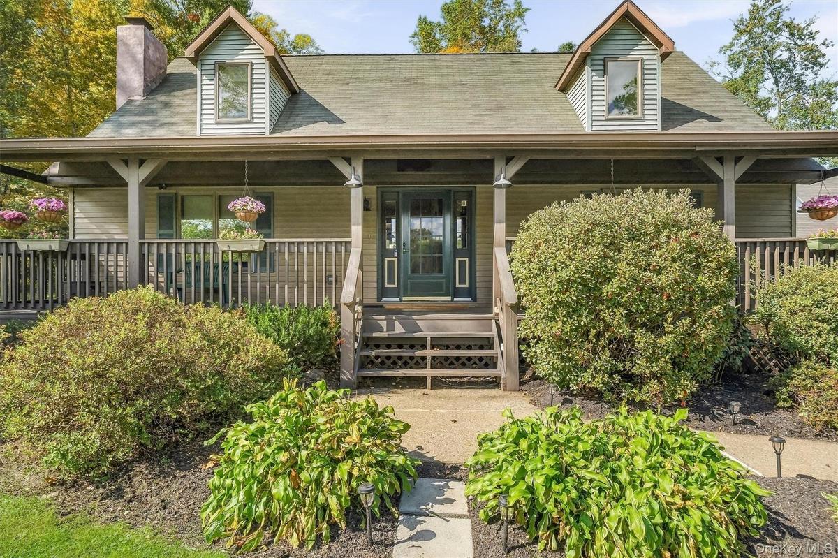 Mature gardens and a generous front porch welcome you home.