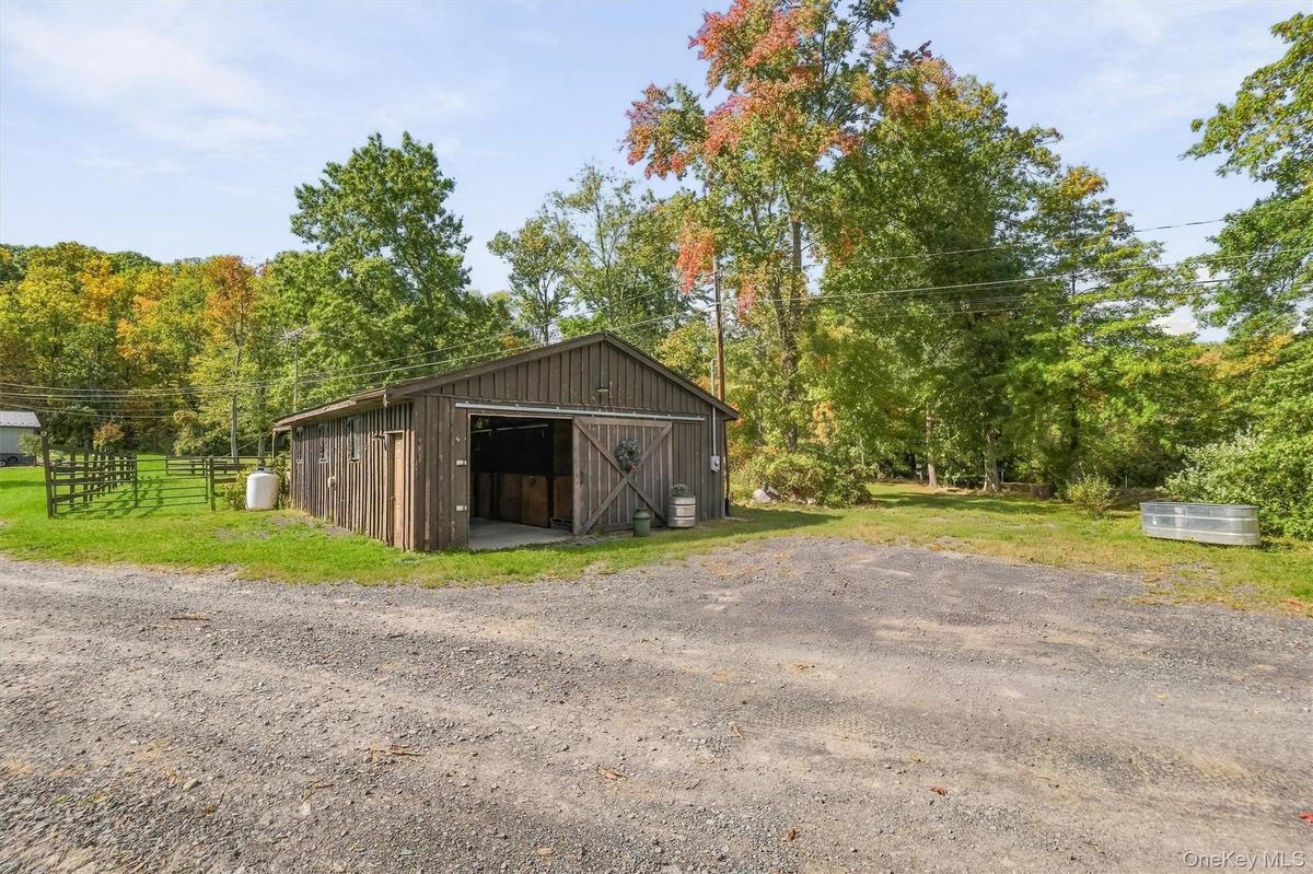 A sweet 3 stall barn with parking for trailers or golf carts!
