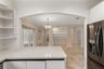 Open Kitchen Leads to Living, Family and Dining Room Areas