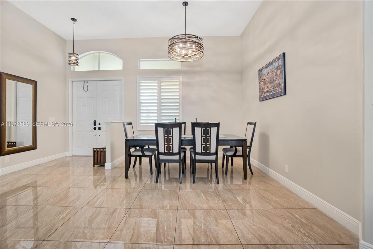 Flexible floor plan - featuring dining and living rooms - easily used as a home office/ 4th bedroom