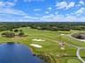 Community lake and golf course, virtually staged, selected golf carts removed