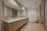 Master Bathroom features a book-matched marble wall, marble flooring along with European Dornbracht® fixtures.