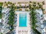 Ocean-view infinity pool with full poolside service.