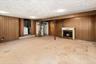 The lower level, with a decorative fireplace and plenty of room