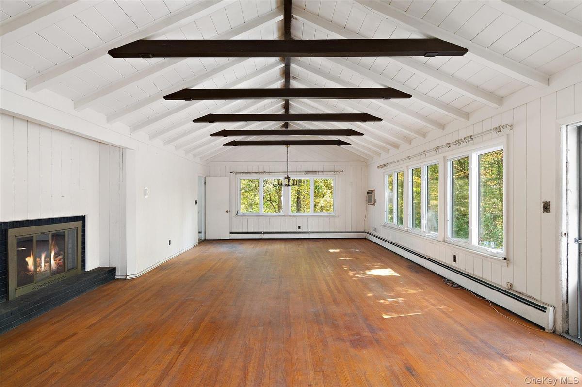 Beams overhead, fire on one end, woods on every side