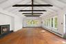 Beams overhead, fire on one end, woods on every side