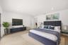Designed as a true private guest retreat, this spacious suite offers exceptional comfort, privacy, and direct access to the backyard through oversized