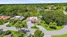 From above, the true rarity of this property comes into focus. Perfectly positioned on an oversized cul de sac lot, the home backs directly to a prote