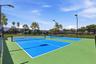 Enjoy one of the community's most popular amenities with beautifully maintained pickleball courts featuring covered seating, providing the perfect pla