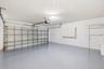 The oversized two-car garage offers an abundance of space for vehicles, storage, hobbies, and recreational equipment. Finished with an epoxy-coated fl