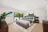 Designed as a true private guest retreat, this spacious suite offers exceptional comfort, privacy, and direct access to the backyard through oversized