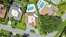 From above, the true rarity of this property comes into focus. Perfectly positioned on an oversized cul de sac lot, the home backs directly to a prote