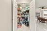 There is no shortage of storage in this home. Along with all of the kitchen cabinetry comes this walk-in pantry for all of your chef-inspired needs.