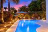 The resort-style pool starts underneath the roof line and expands down the oversized lot. Swim Olympic laps in your own backyard.