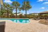 The resort-style pool starts underneath the roof line and expands down the oversized lot. Swim Olympic laps in your own backyard.