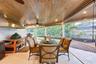 Live the epitome of the South Florida lifestyle with this 1,360 sq. ft. patio. It offers a built-in bar with quartz countertops, a grill area with hoo