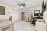 Guest bedroom 1 is spacious with large impact windows and ample closet space.