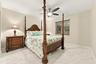 Guest bedroom 3 offers lots of natural light through a hurricane impact glass window and lots of closet space.