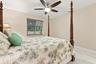 Guest bedroom 3 offers lots of natural light through a hurricane impact glass window and lots of closet space.
