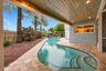 The resort-style pool starts underneath the roof line and expands down the oversized lot. Swim Olympic laps in your own backyard.
