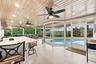 Live the epitome of the South Florida lifestyle with this 1,360 sq. ft. patio. It offers a built-in bar with quartz countertops, a grill area with hoo