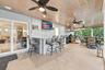 Live the epitome of the South Florida lifestyle with this 1,360 sq. ft. patio. It offers a built-in bar with quartz countertops, a grill area with hoo