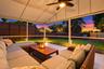 Live the epitome of the South Florida lifestyle with this 1,360 sq. ft. patio. It offers a built-in bar with quartz countertops, a grill area with hoo