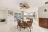 The dining space and eat-in kitchen are highlighted by new floors and a beautifully updated kitchen with quartz countertops and stainless steel applia