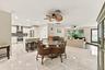 The dining space and eat-in kitchen are highlighted by new floors and a beautifully updated kitchen with quartz countertops and stainless steel applia