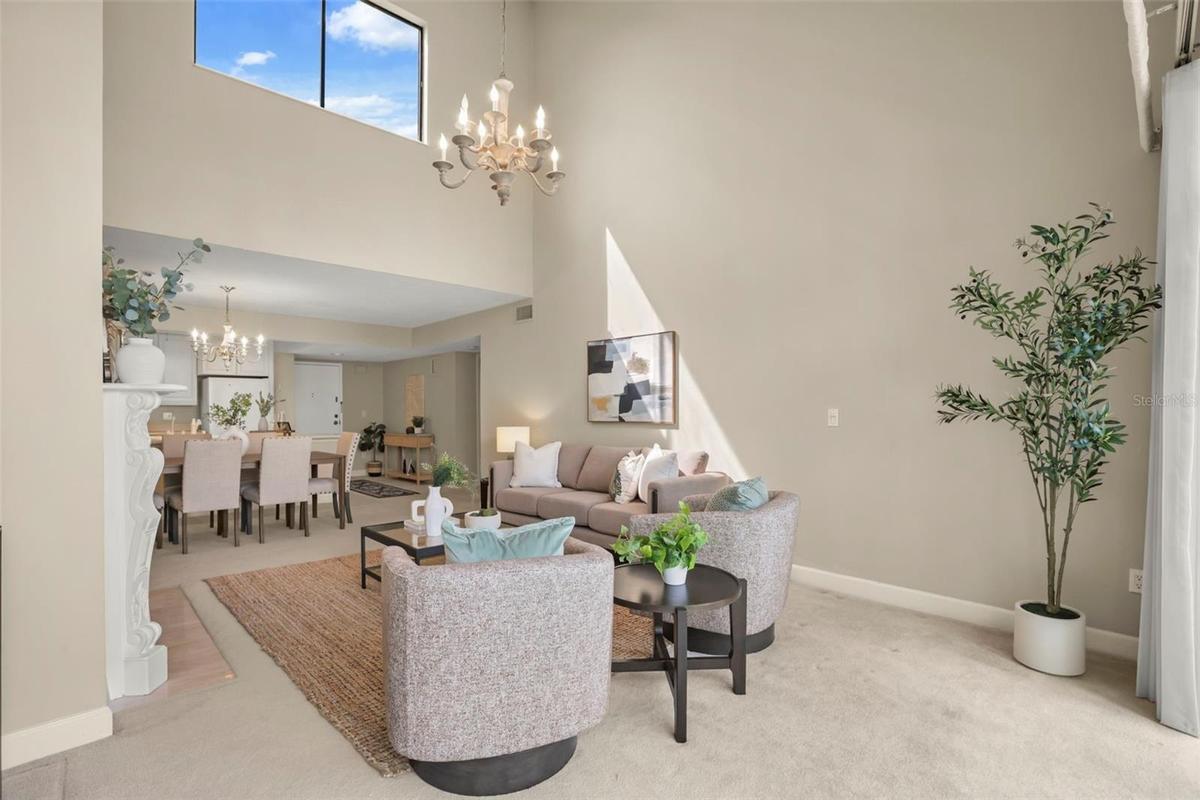 The top-floor location means natural light fills the large living room with additional windows along the vaulted ceiling!
