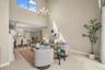 The top-floor location means natural light fills the large living room with additional windows along the vaulted ceiling!
