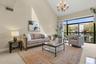 Stress-free condo living doesn't mean smaller space in this spectacular home. The living room is open, bright, and spacious!