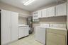 This condo boasts an IN UNIT laundry room with phenomenal storage above the washer and dryer and additional cabinets and counter space adjacent.
