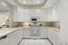 Both cabinet storage and counter space are abundant in this bright kitchen!