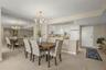 The dining room and large foyer frame the kitchen.